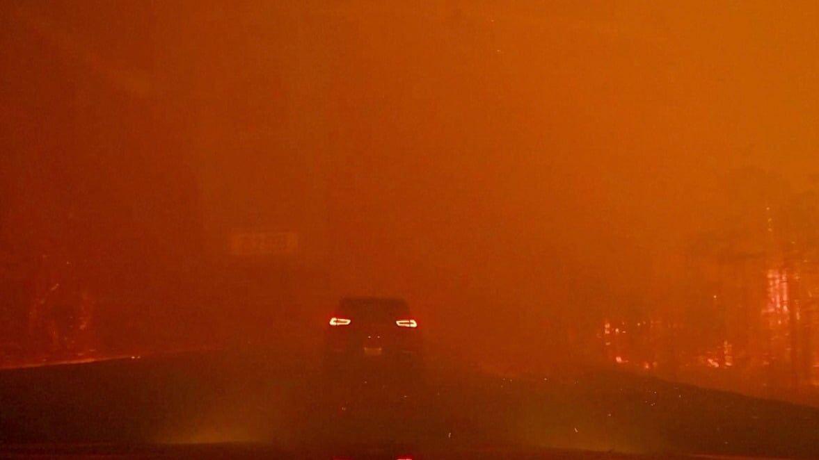 Dashcam video captures driver escaping a wildfire in Canada